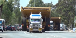 Tri Drive Mack Titan with a Caterpillar 785C dump truck