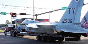 Moving a F-15C Fighter Jet with Semi-trailer Truck