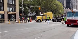 International and Peterbilt trucks hauling Manitowoc 18000 parts out of WTC