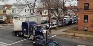 truck making tight turn on residental street